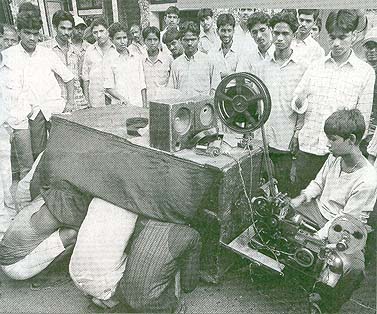 Movie peepshow in the slums of Calcutta on a late 19th century Japanese projector